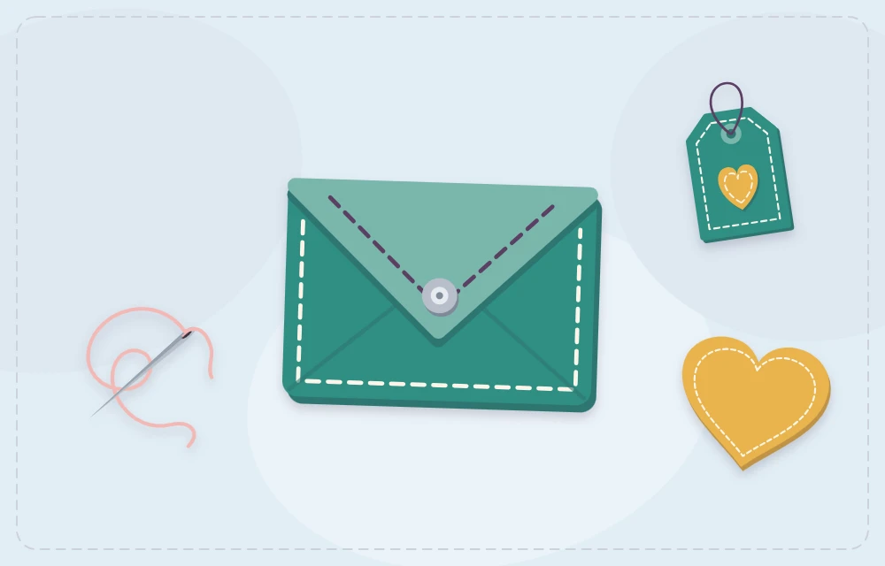 A stitched felt envelope with a gift tag, felt heart and threaded needle