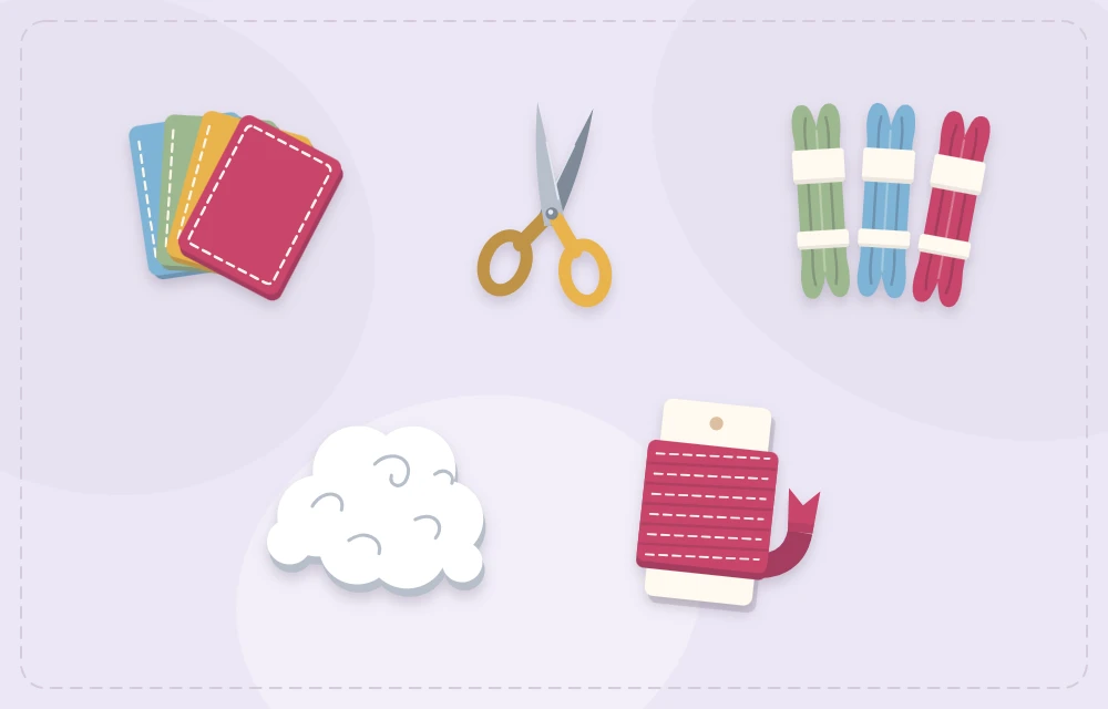 Felt sheets, scissors, embroidery floss, stuffing and ribbon laid out together