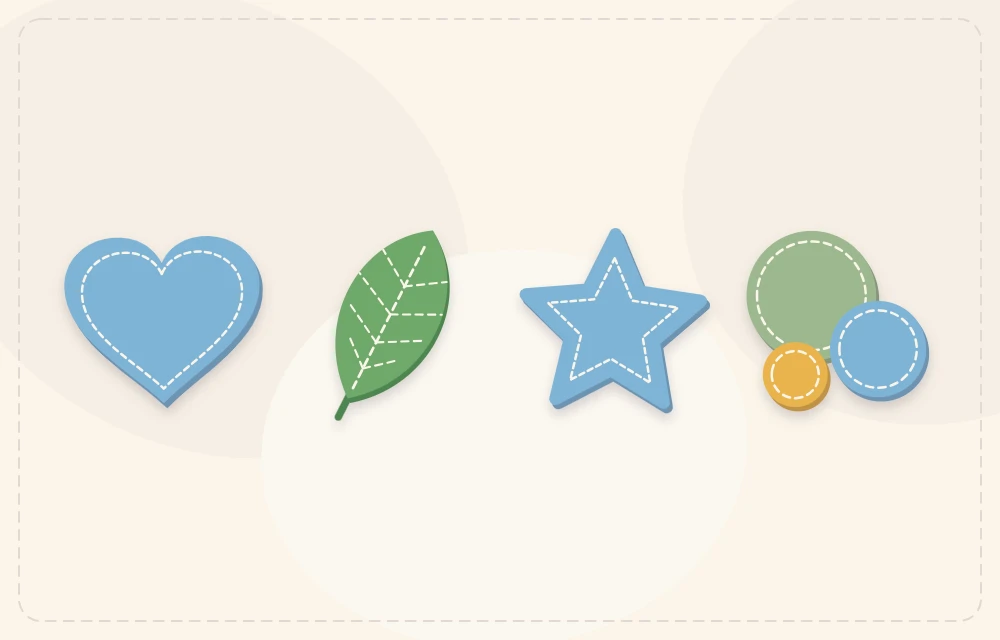 Cut felt heart, leaf, star and circles arranged in a row