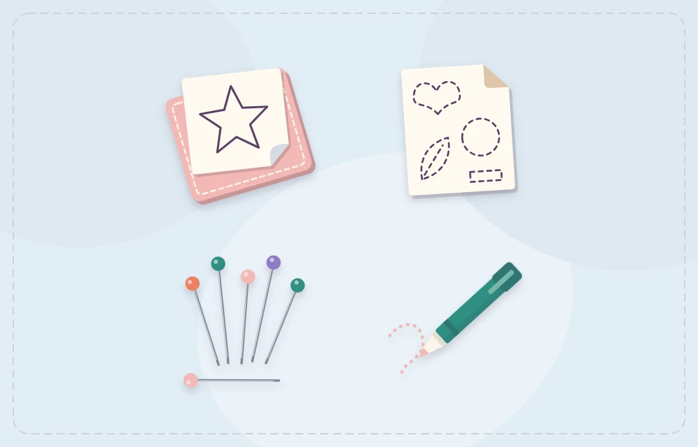 Freezer paper, a paper template, pins and a fabric pen laid out together