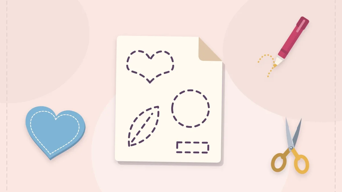 Paper template with a fabric pen, scissors and a cut felt heart