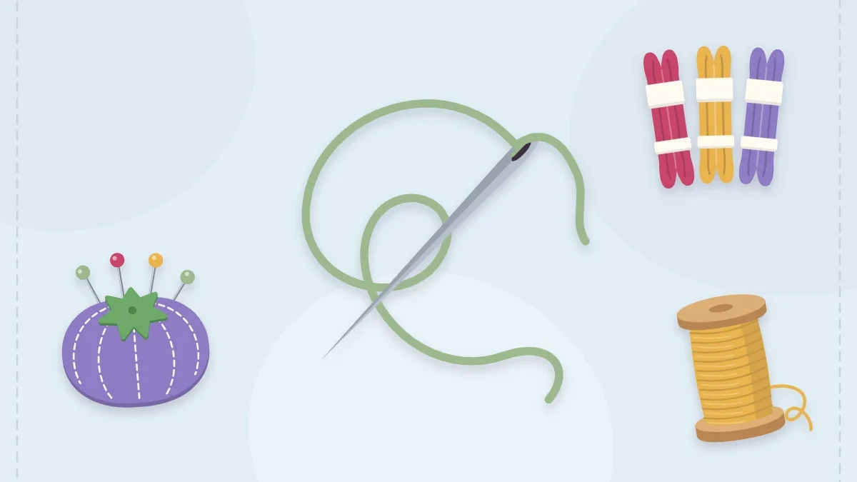 Threaded needle with embroidery floss skeins, a thread spool and a pincushion